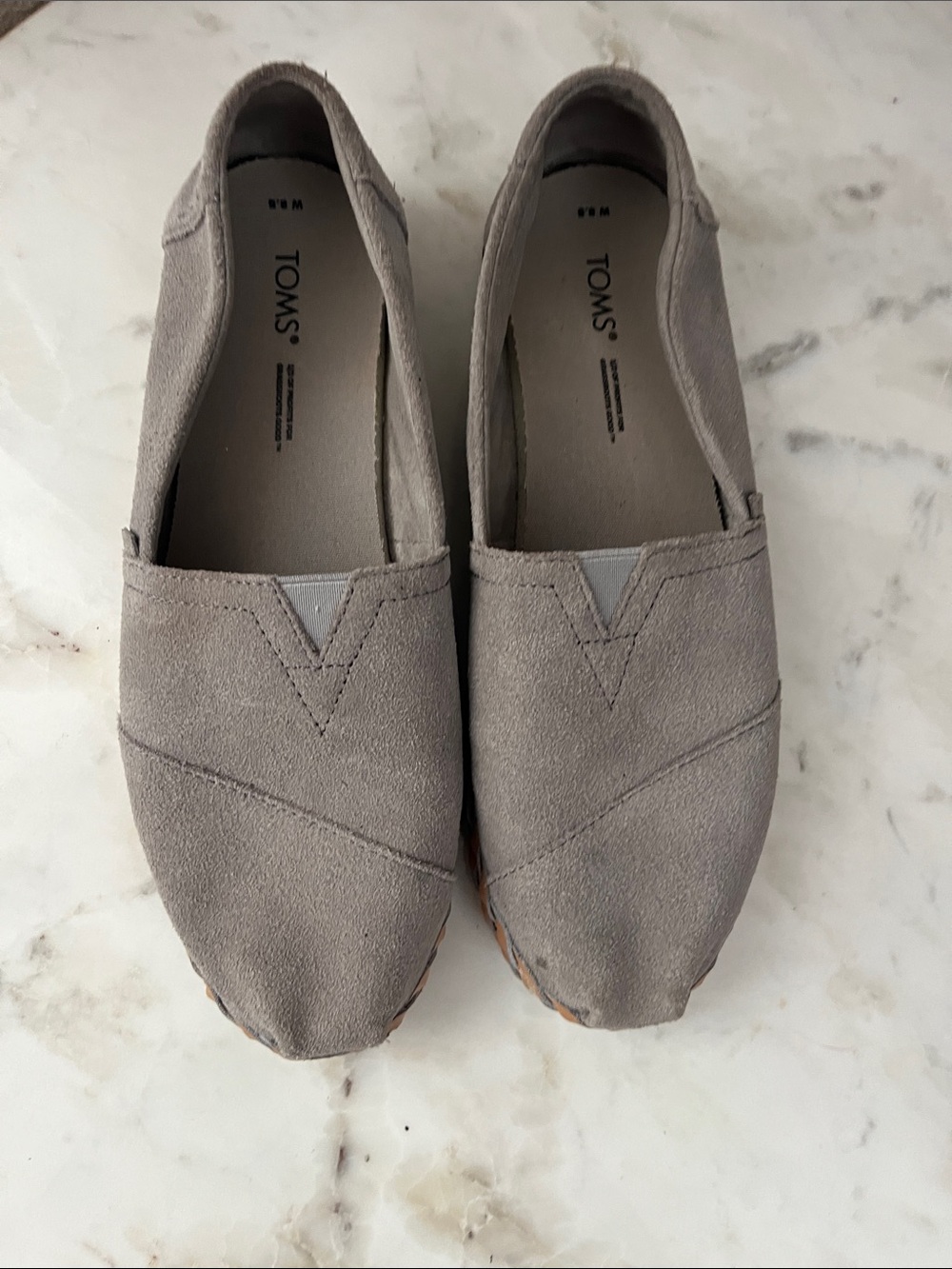 TOMS Grey/Taupe Suede Women’s Slip-On Loafers with Leather twist band.